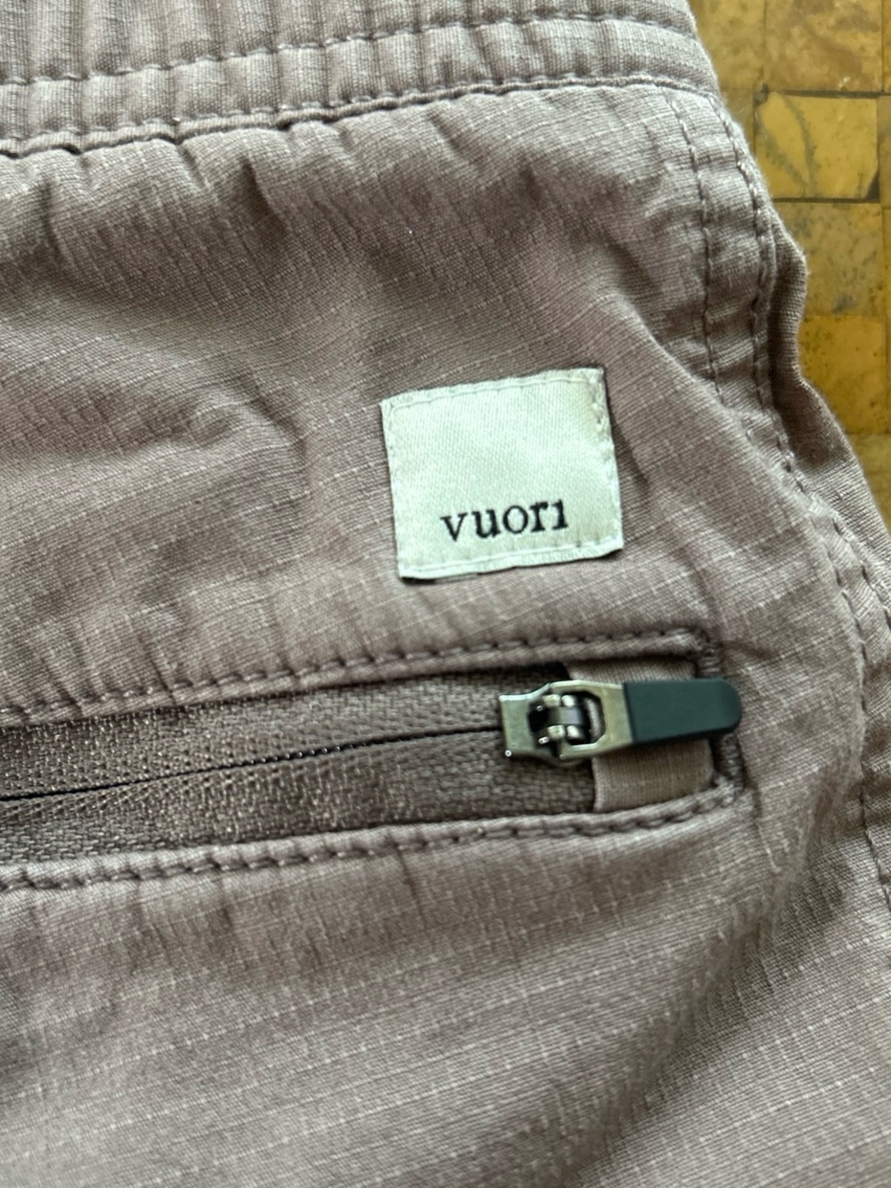 Vuori mauve zip-pocket pants with logo patch
